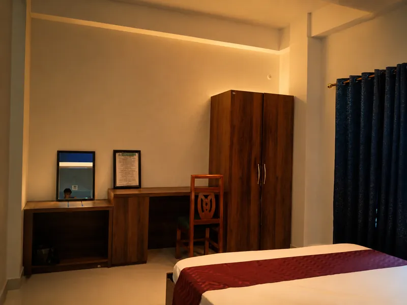 Hollong Suite second bedroom with desk and wardrobe