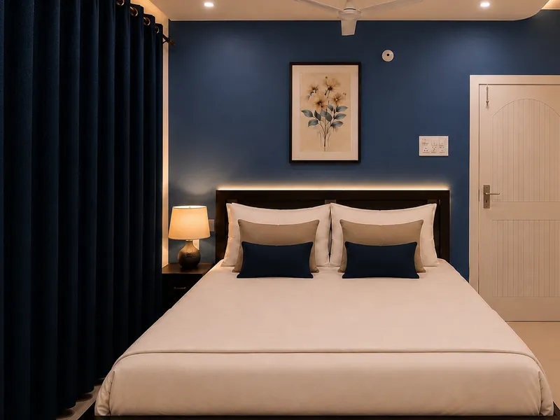 Simolu Suite bedroom with double bed and blue feature wall